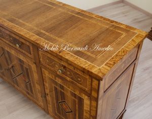Handcrafted sideboard made of solid wood and richly inlaid in walnut and olive wood in neo-classical style